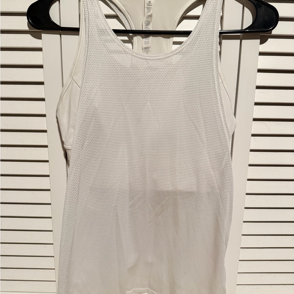 Lululemon Pushing Limits Tank in white with a built-in bra.